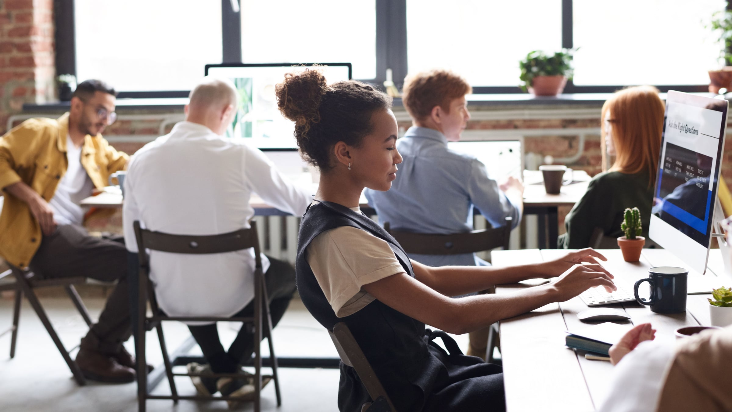 Colleagues working together in a bright office