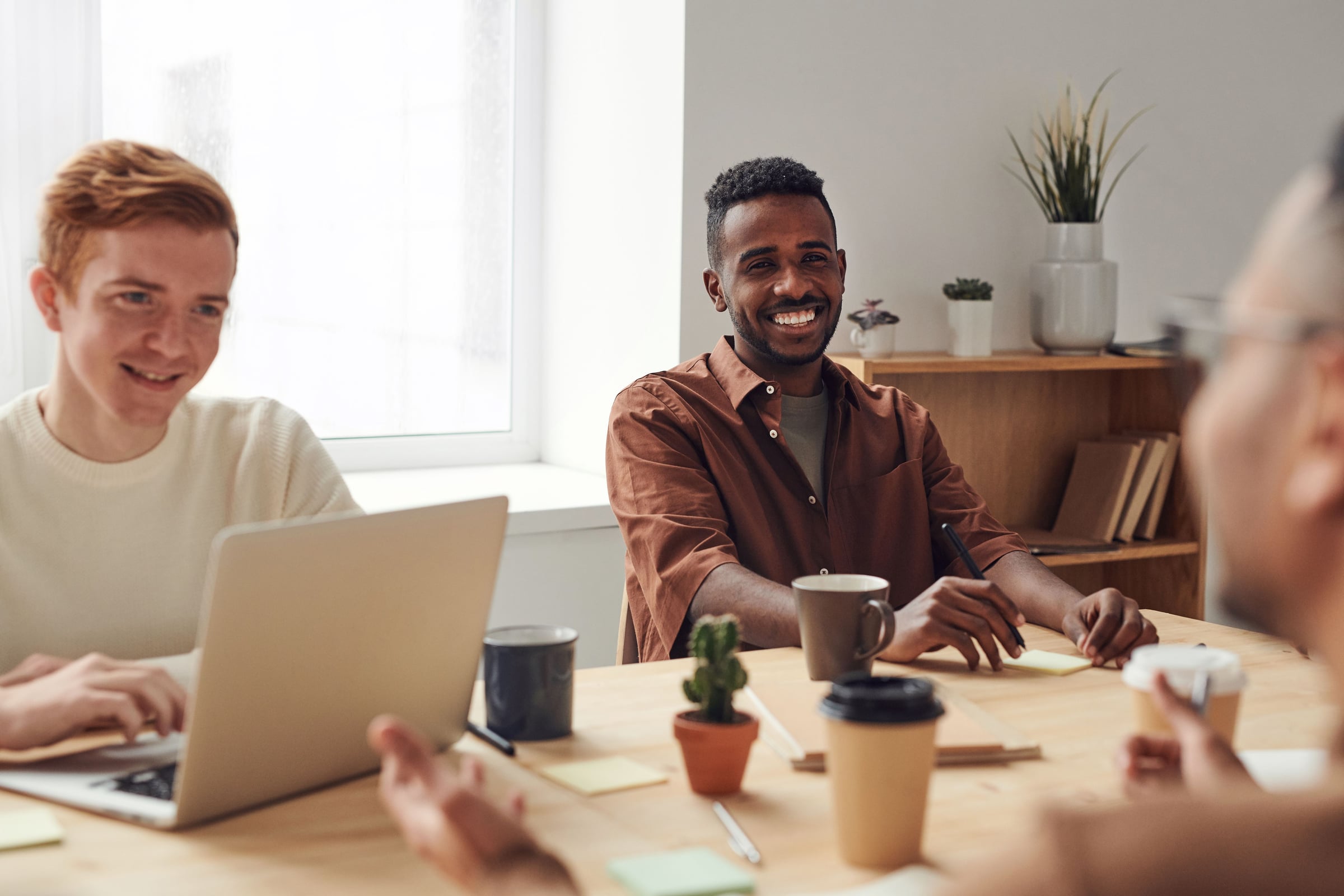 A team meeting around a table at work