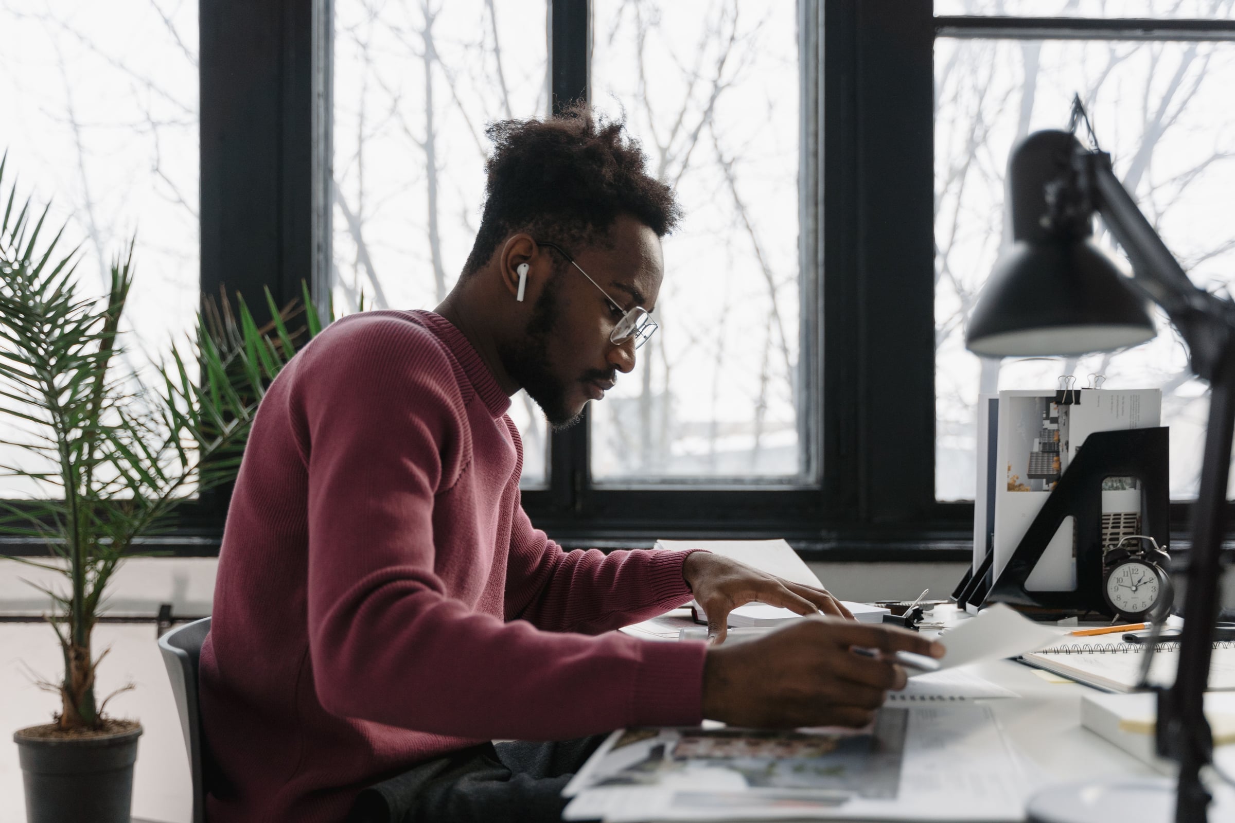 A professional reviewing work at his desk