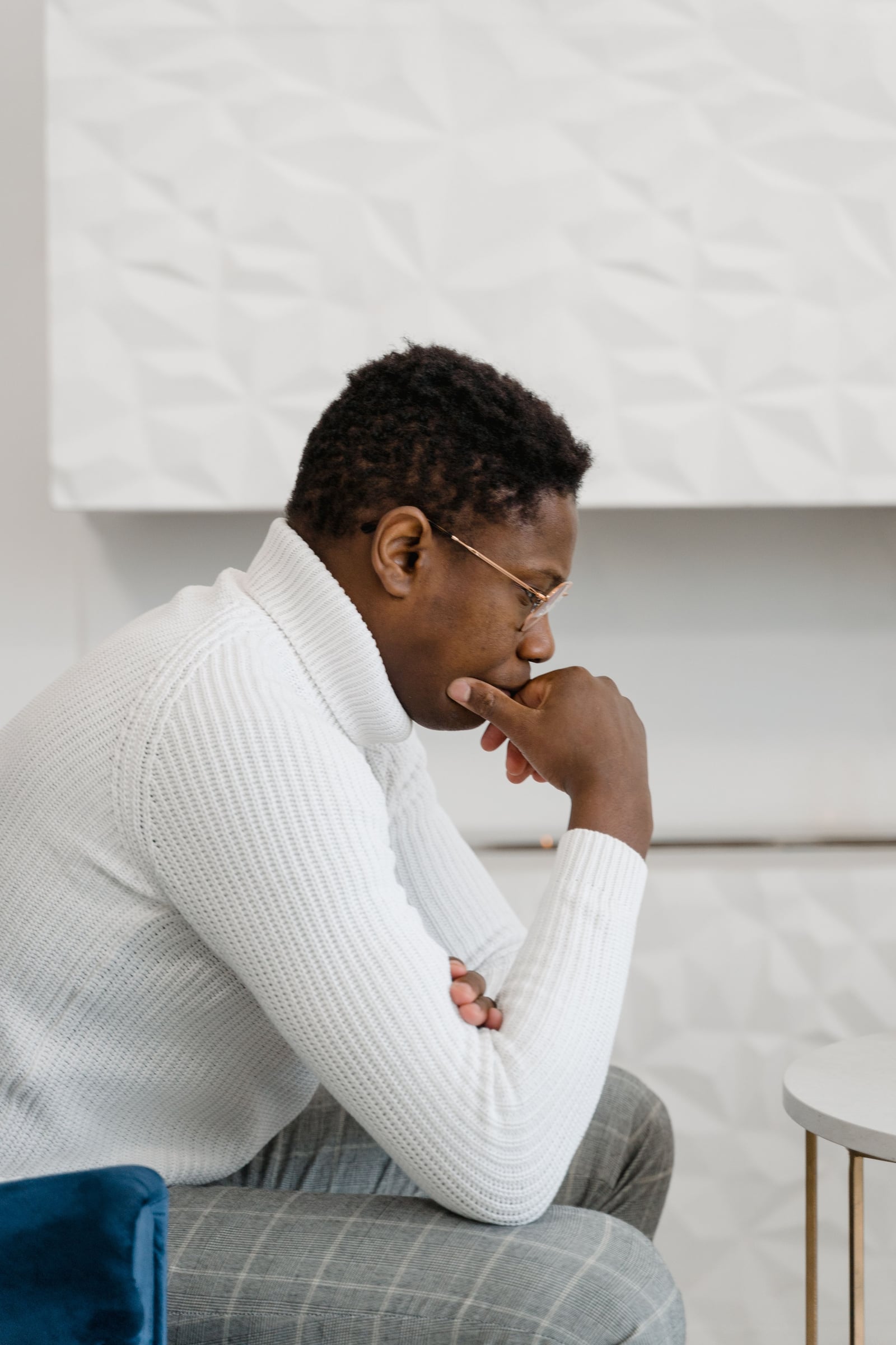A man sitting in thought, away from his job title