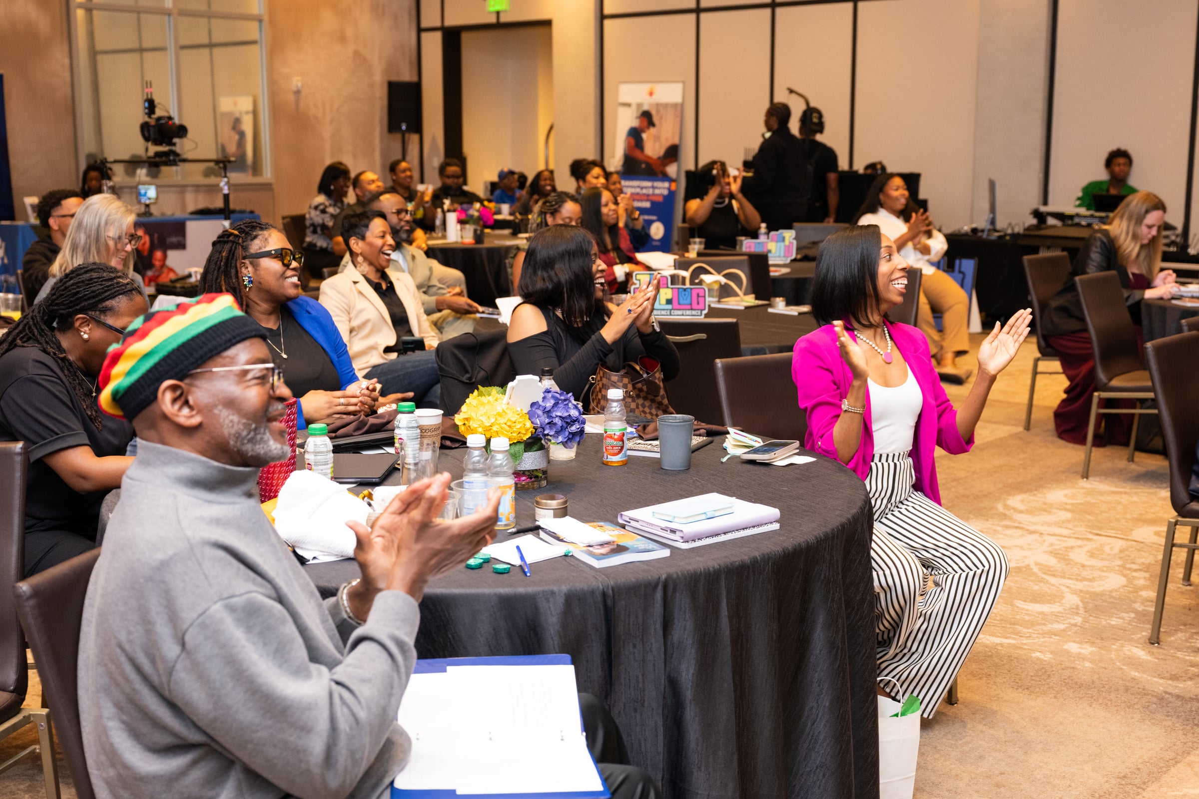 Participants clapping during a session at UNPLUG