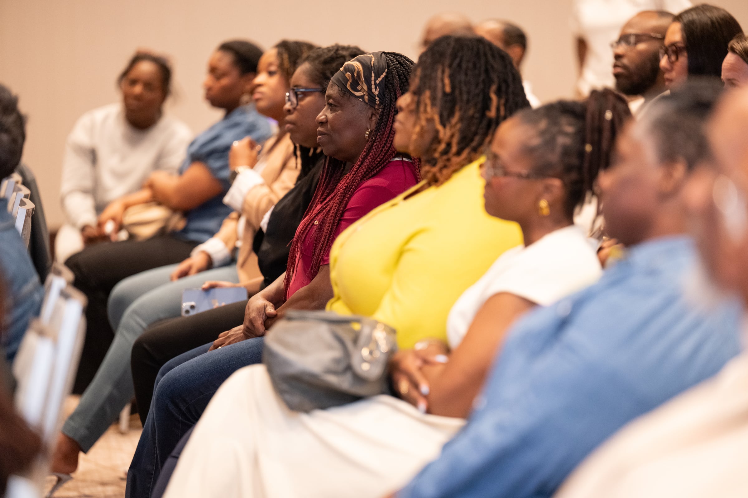 Professionals seated in the audience at UNPLUG
