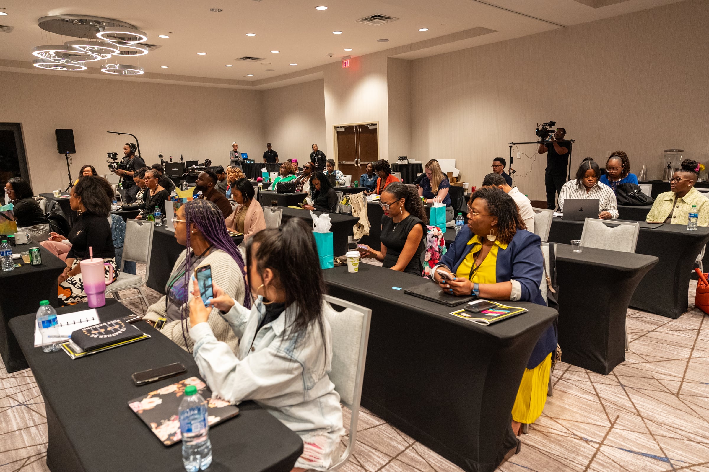 Professionals seated together at the UNPLUG leadership conference